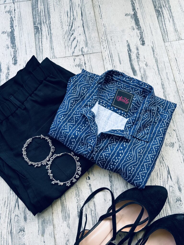 Chic blue bandhani shirt paired with formal trousers.